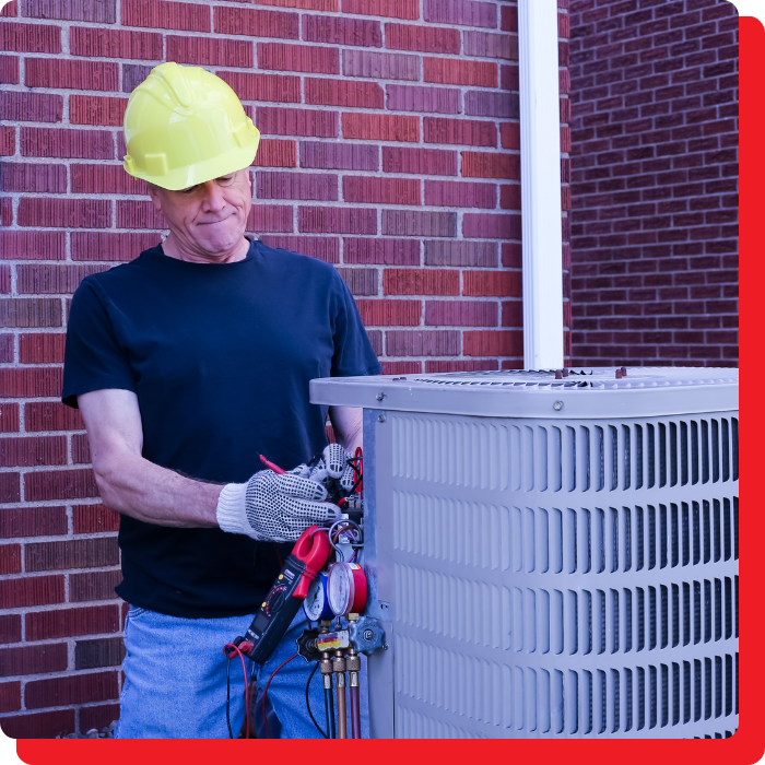 a man working on an ac unit